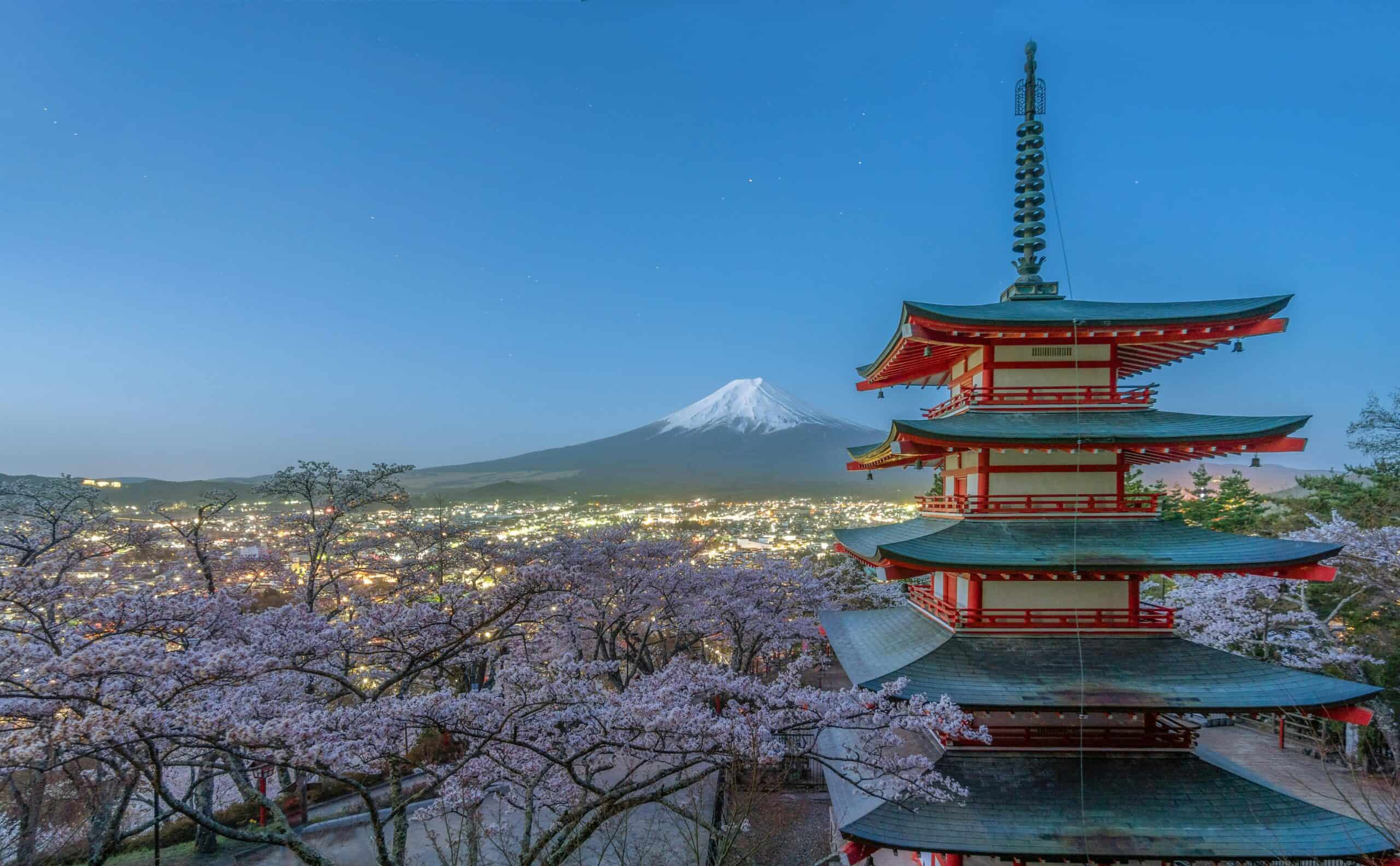 Fujiyoshida, Japan.
Red and Green Pagoda Temple Near Trees and Mountain
